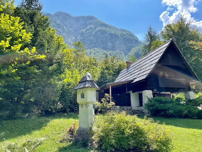 Red Beech Cabin's garden with a small wayside shrine