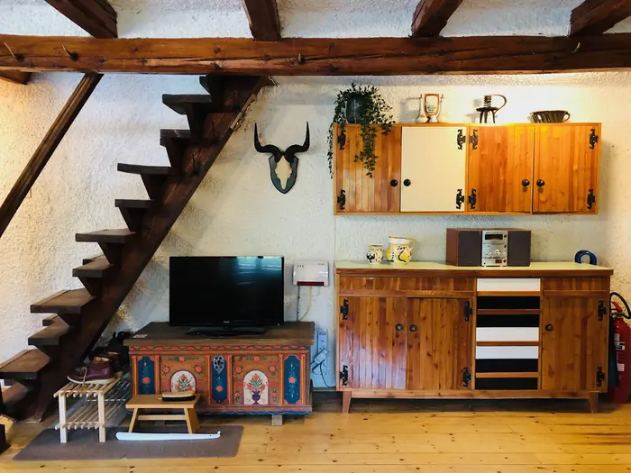 Inside Red Beech Cabin — original wood-beamed interior (photo 14)