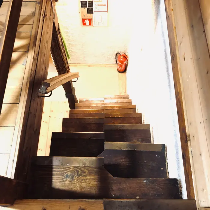 Inside Red Beech Cabin — original wood-beamed interior (photo 17)