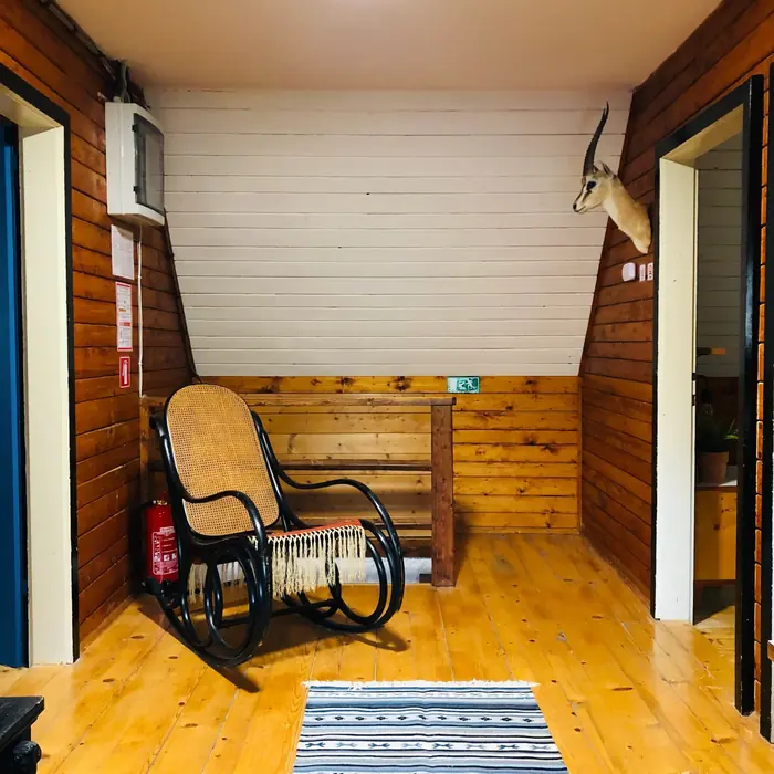 Inside Red Beech Cabin — original wood-beamed interior (photo 18)