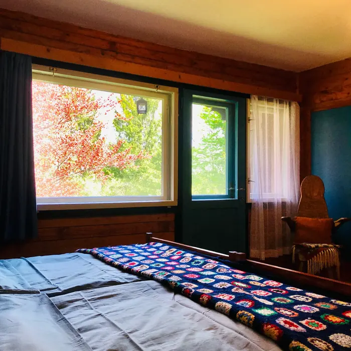 Inside Red Beech Cabin — original wood-beamed interior (photo 23)