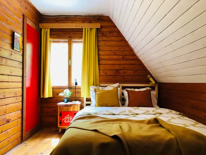 Inside Red Beech Cabin — original wood-beamed interior (photo 26)